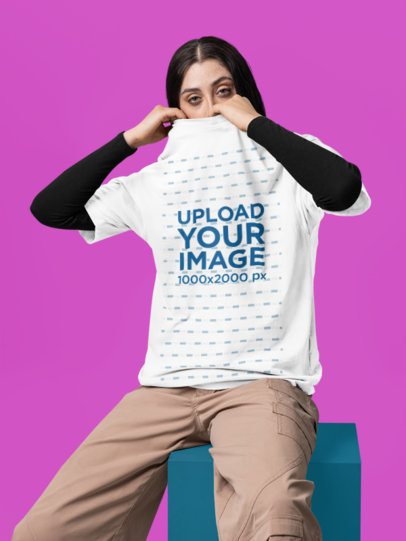 Oversized T-Shirt Mockup Featuring a Woman Covering Half Her Face With a Garment m57410