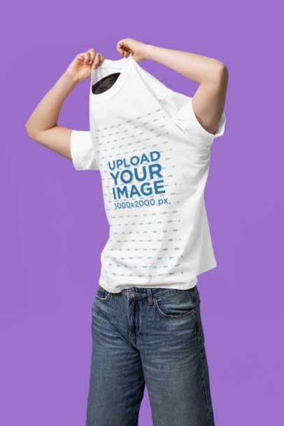 Comfort Colors Mockup Featuring a Woman Taking Off Her T-Shirt in a Studio m57431