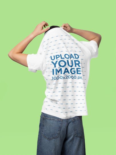Back-View Mockup of a Woman Taking Off Her Comfort Colors Tee in a Studio m57432