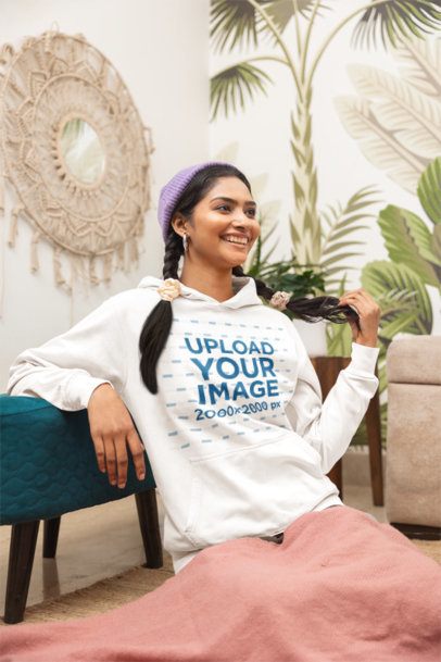 Pullover Hoodie Mockup of a Cheerful Woman Laughing in a Cozy Room Setting m55429