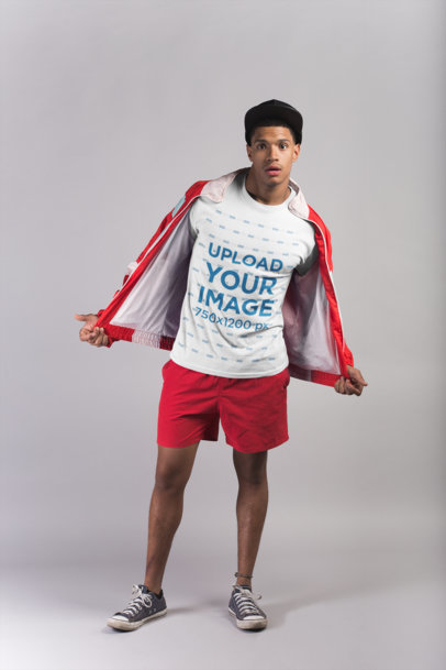 T-Shirt Mockup of a Man Acting Cool in a Studio
