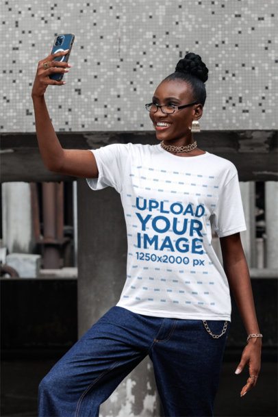 Round-Neck Tee Mockup of a Happy Woman With Glasses Taking a Selfie