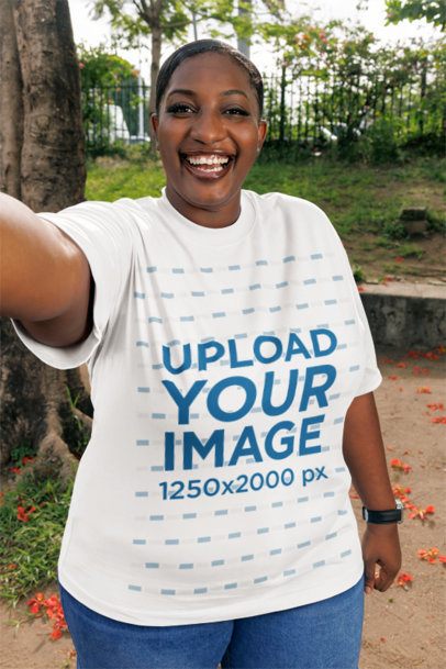 Selfie Mockup Featuring a Happy Woman Wearing an Oversized Tee in the Park m56948