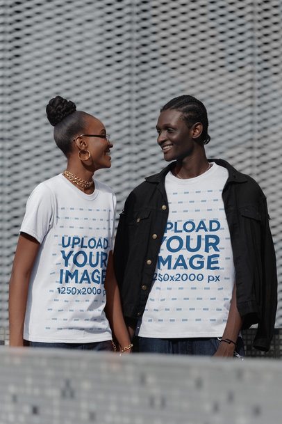 Round-Neck Tee Mockup of a Joyful Couple Holding Hands in the Street