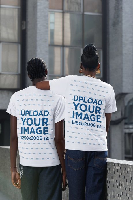 Back-View Mockup Featuring a Woman and a Man Wearing Matching T-Shirts in the Street