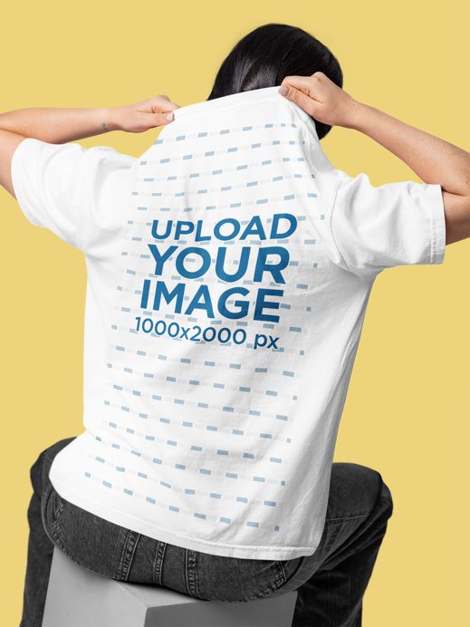 Back-View Mockup Featuring a Woman Wearing a Pocket Tee in a Studio Setting