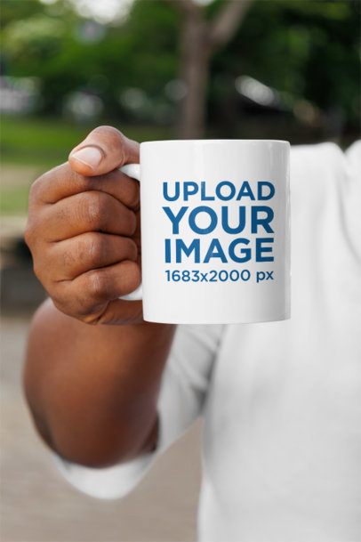 Close-Up Mockup of a Woman's Hand Holding a Sublimated Coffee Mug