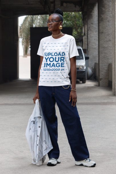 T-Shirt Mockup of a Stylish Serious Woman Walking on the Street