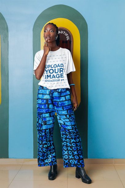 Round-Neck Tee Mockup of a Woman Posing in an Artsy Setting