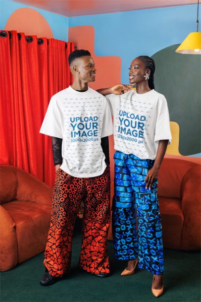 Oversized Tee Mockup of a Happy Woman Posing With a Smiling Man in a Colorful Living Room