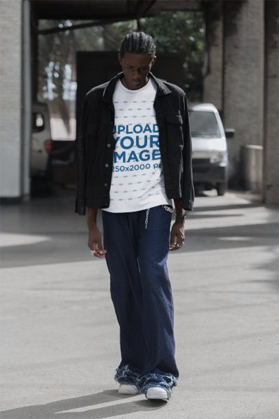 Round-Neck Tee Mockup of a Man Walking in the Street With a Serious Look