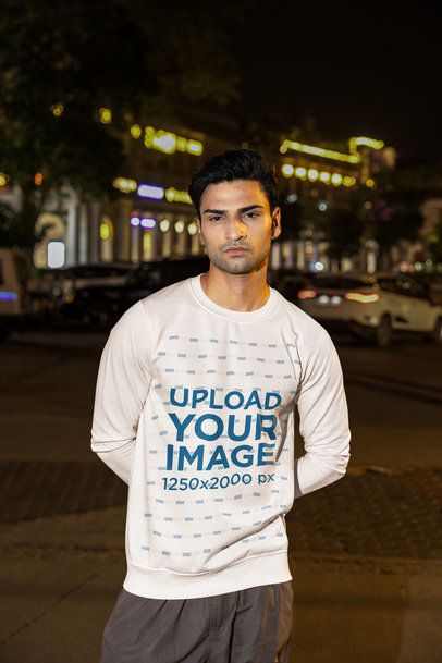 Sweatshirt Mockup Featuring a Serious Man in the Street at Night m56865