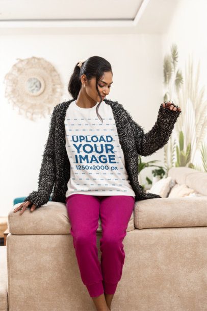 Crewneck Sweatshirt Mockup of a Chill Woman Sitting on a Cozy Couch m55388