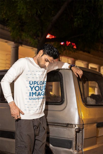 Sweatshirt Mockup of a Serious Man Leaning Against a Vintage Truck in the Street m56862