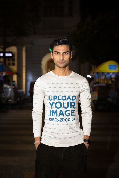 Bella Canvas Long-Sleeve Tee Mockup of a Man Posing in a Street by Night m56879