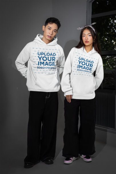 Hoodie Mockup of a Serious Man With a Woman Standing Near a Window m54165