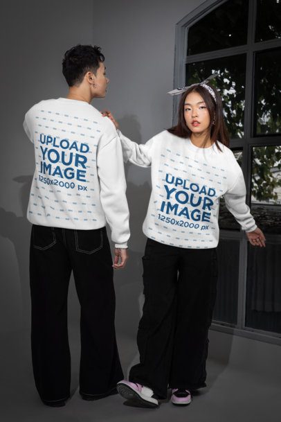 Sweatshirt Mockup Featuring a Man and a Woman Posing Next to a Window m54162