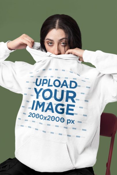 Comfort Colors Mockup Featuring a Woman Wearing a Pullover Hoodie in a Colorful Setting m57418