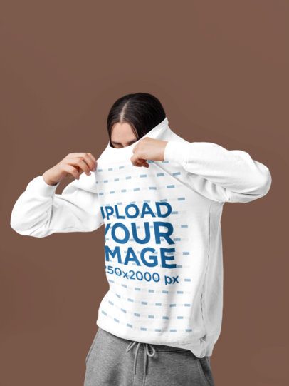 Comfort Colors Mockup Featuring a Woman Putting On Her Sweatshirt in a Studio m57422