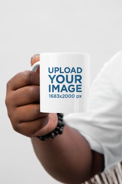 Mockup of a Man's Hand Holding a Sublimated 11 Oz Coffee Mug