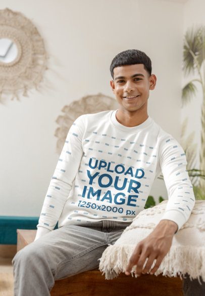 Sweatshirt Mockup of a Smiling Man Sitting on a Cozy Spot in a Living Room m55381