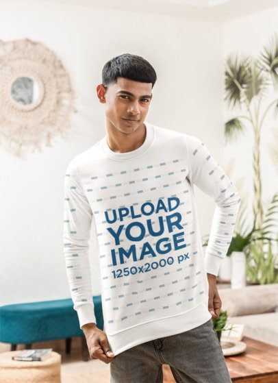 Sweatshirt Mockup Featuring a Smiling Man Posing in a Cozy Living Room m55383