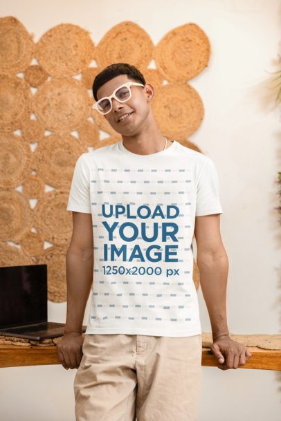 Round-Neck T-Shirt Mockup Featuring a Happy Man Standing in a Cozy Spot m55407