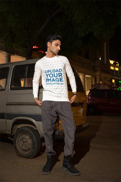 Crewneck Sweatshirt Mockup Featuring a Man Posing in a Parking Lot by Night m56860