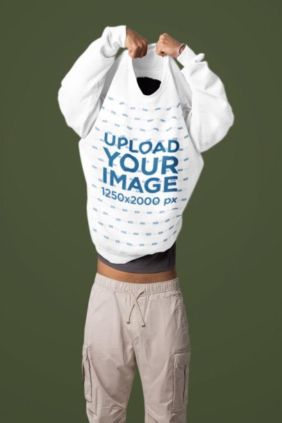 Comfort Colors Mockup of a Man Taking Off His Sweatshirt in a Studio m57425