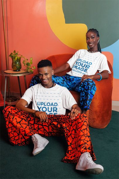 T-Shirt Mockup of a Happy Man and a Woman Sitting in a Colorful-Styled Living Room