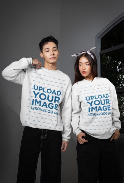 Sweatshirt Mockup of an Alternative-Styled Couple Standing Against a Window m54160