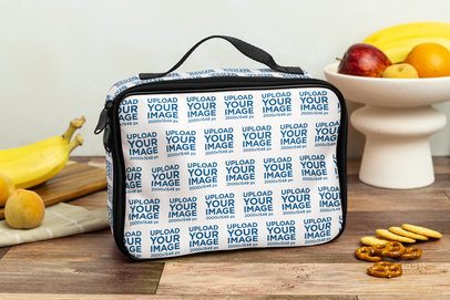 Mockup of a Lunch Bag Placed on a Wooden Table Surrounded by Fruits and Snacks m57822