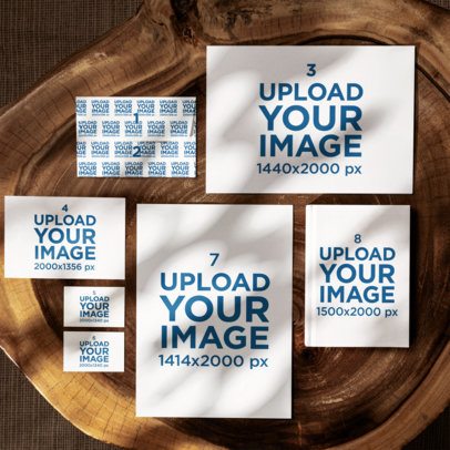 Stationery Mockup of a Book Placed With Business Cards and Paper Sheets on a Wooden Surface m57556