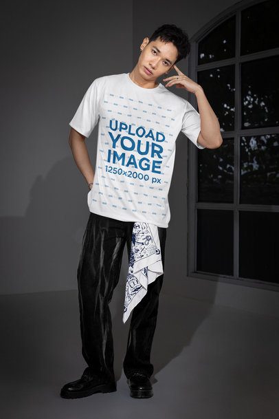 Oversized T-Shirt Mockup Featuring a Serious Man With an Alternative Look Posing Near a Window m54179