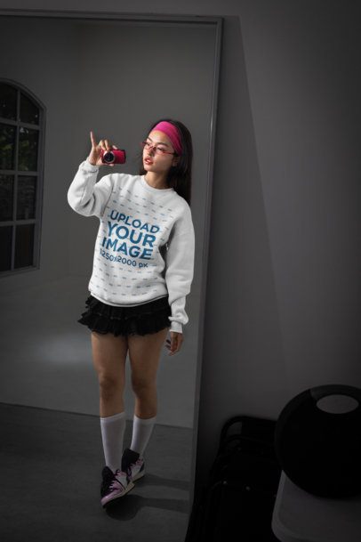 Sweatshirt Mockup Featuring a Woman Taking a Mirror Selfie With a Camera m54174