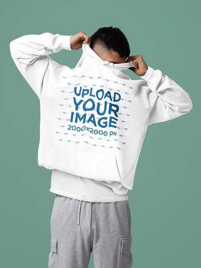 Comfort Colors Pullover Hoodie Mockup of a Man Covering His Face in a Studio m57420