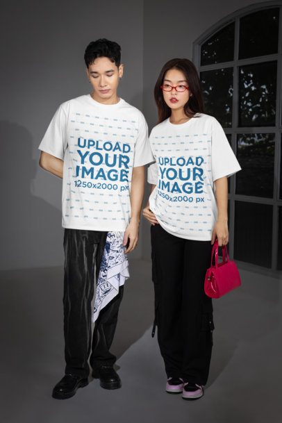 Oversized T-Shirt Mockup Featuring an Alternative-Styled Serious Couple Posing in a Room m54182