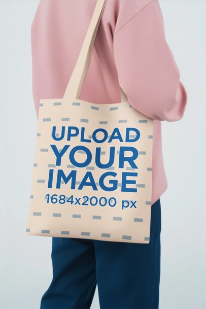 Mockup of an AI-Generated Person Carrying a Sublimated Tote Bag in a Studio Setting m55081
