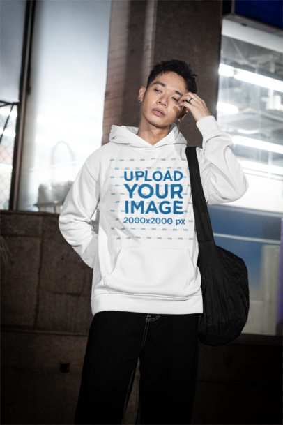 Hoodie Mockup of a Man Walking in the Street With an Alternative Style m54207