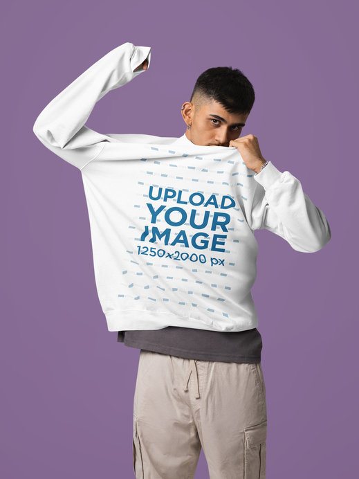 Comfort Colors Mockup Featuring a Man in a Sweatshirt Posing With a Serious Look in a Studio