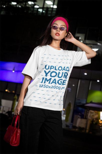Oversized T-Shirt Mockup of a Woman Walking in the Street With an Alternative Style m54212