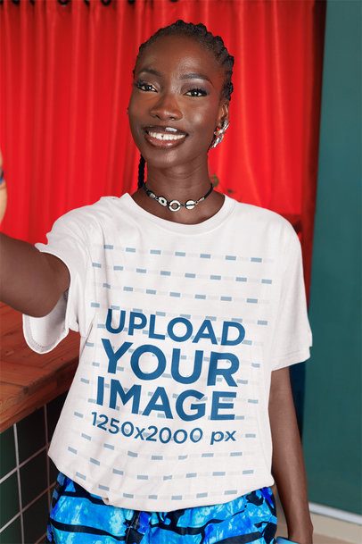Round-Neck T-Shirt Mockup Featuring a Cheerful Woman Taking a Selfie Near a Bar