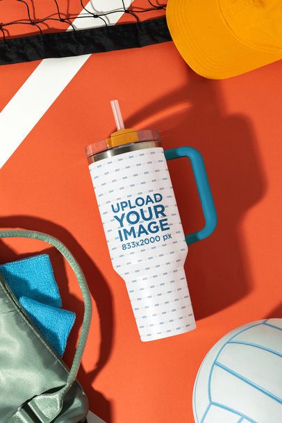 Mockup of a Stanley Tumbler Placed on a Volleyball-Themed Background m57971