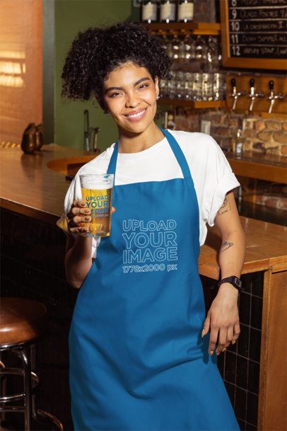 Apron Mockup Featuring a Smiling Tattooed Woman Holding a Shaker Pint Glass Filled With Beer m58071