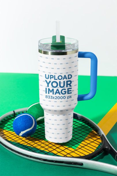 Mockup Featuring a Stanley Tumbler Placed Over a Tennis Racquet m57974