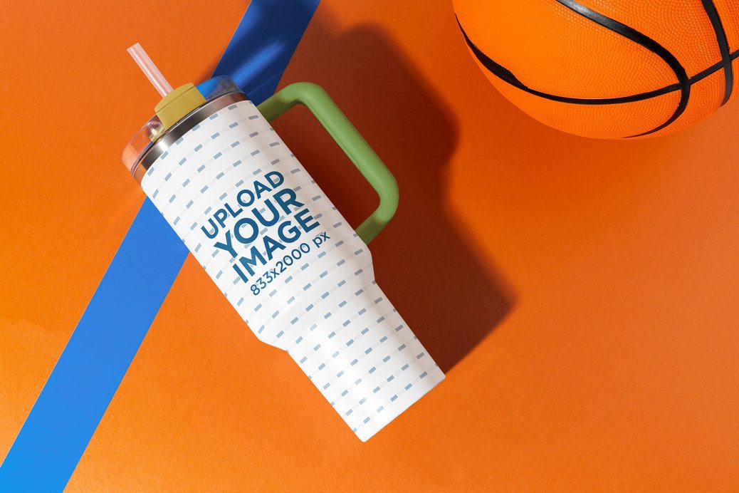 Stanley Mockup Featuring a Tumbler Lying on a Basketball-Themed Backdrop