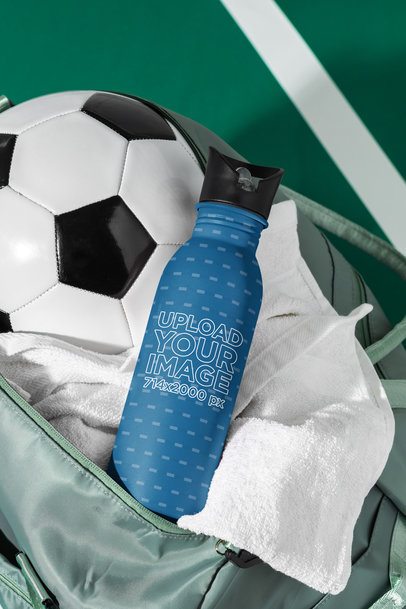 Mockup of an Aluminum Bottle Placed Inside a Bag With a Soccer Ball and a Towel