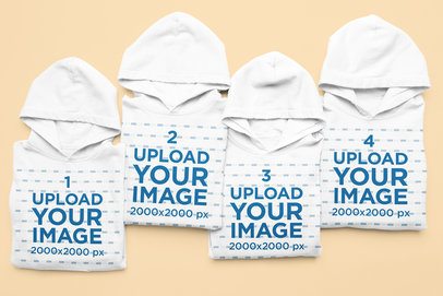 Gildan Mockup of Four Folded Pullover Hoodie Lying on a Colorful Surface m52195