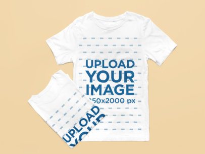 Mockup of Two Bella Canvas Round-Neck T-Shirts Lying on a Customizable Background