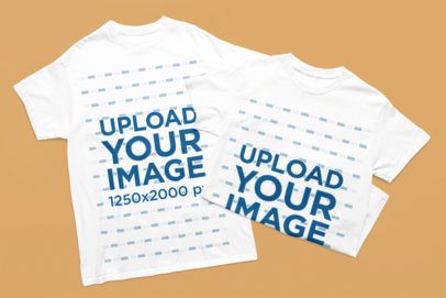 Mockup of Two Gildan Round-Neck T-Shirts Lying on a Colorful Background m52171